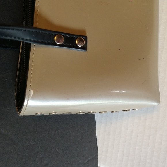 Beijo a pearlized gold color with black straps and trim. - Picture 9 of 14